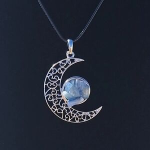 Serene Kyanite crecent moon with 24 inch cord